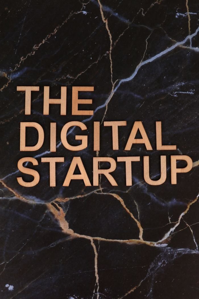 Services Elegant black marble background with bold text 'The Digital Startup'. Perfect for business and technology themes.